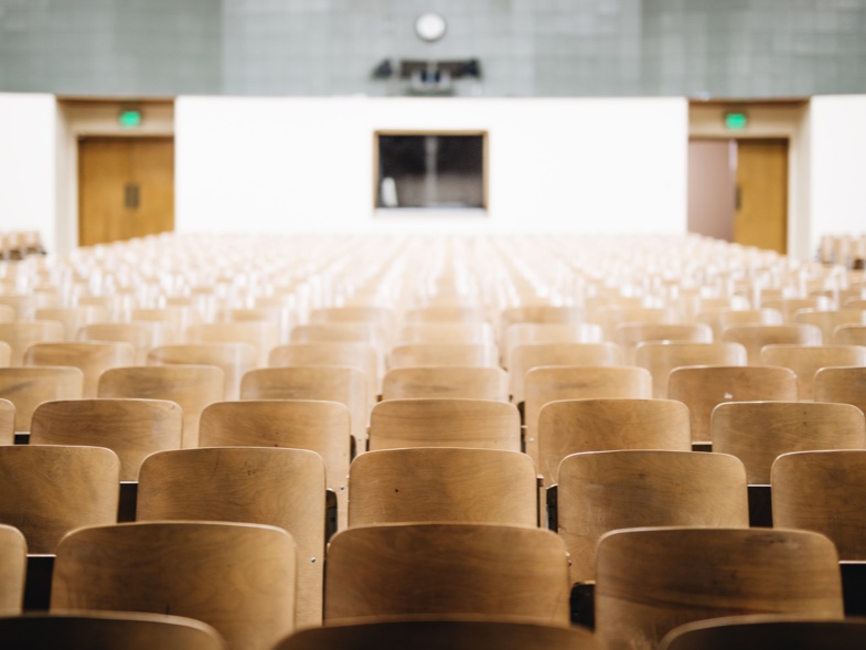 Empty lecture hall, the kind of space affected by AI-driven campus scheduling